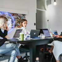 Marketing team at laptops planning digital marketing services for clients