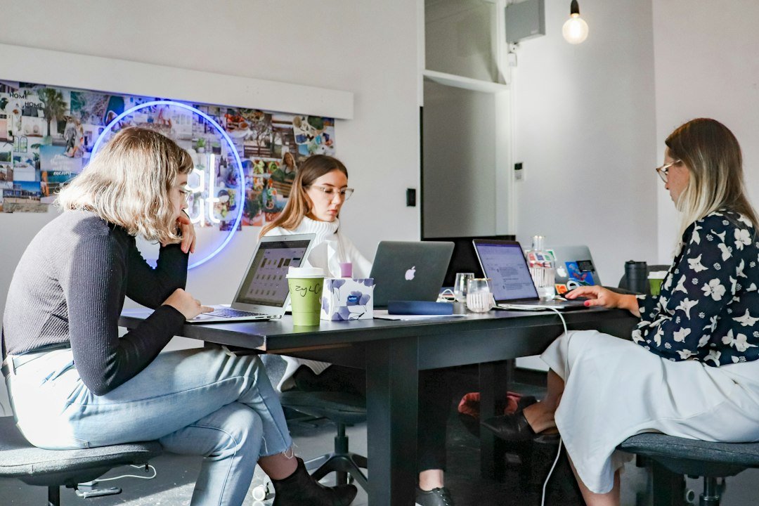 Marketing team at laptops planning digital marketing services for clients