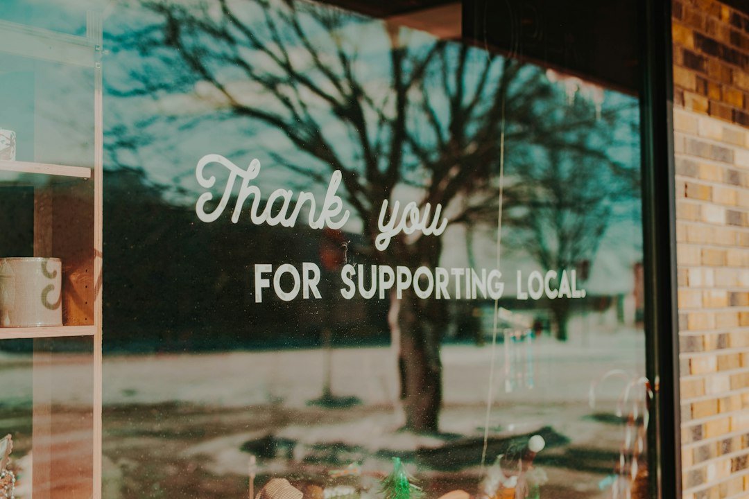 Shop window sign supporting local, illustrating marketing ideas for small business