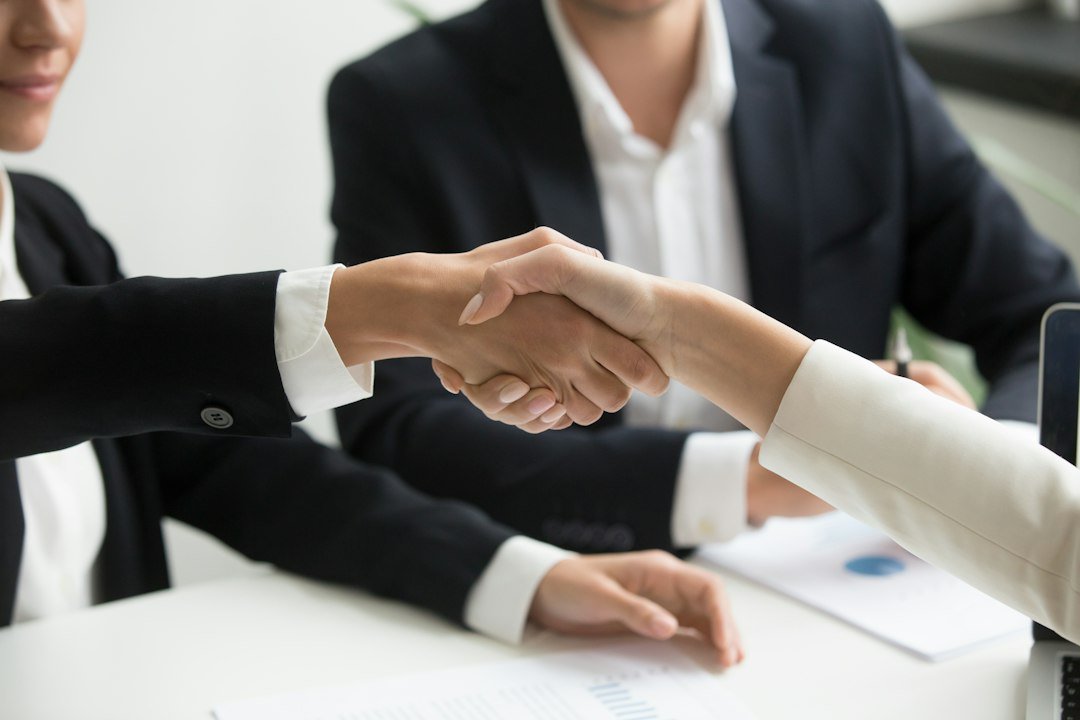 Business owner agreeing terms with an agency to outsource link building