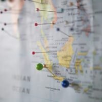 World map with pins marking target markets, planned with SEO consultant services