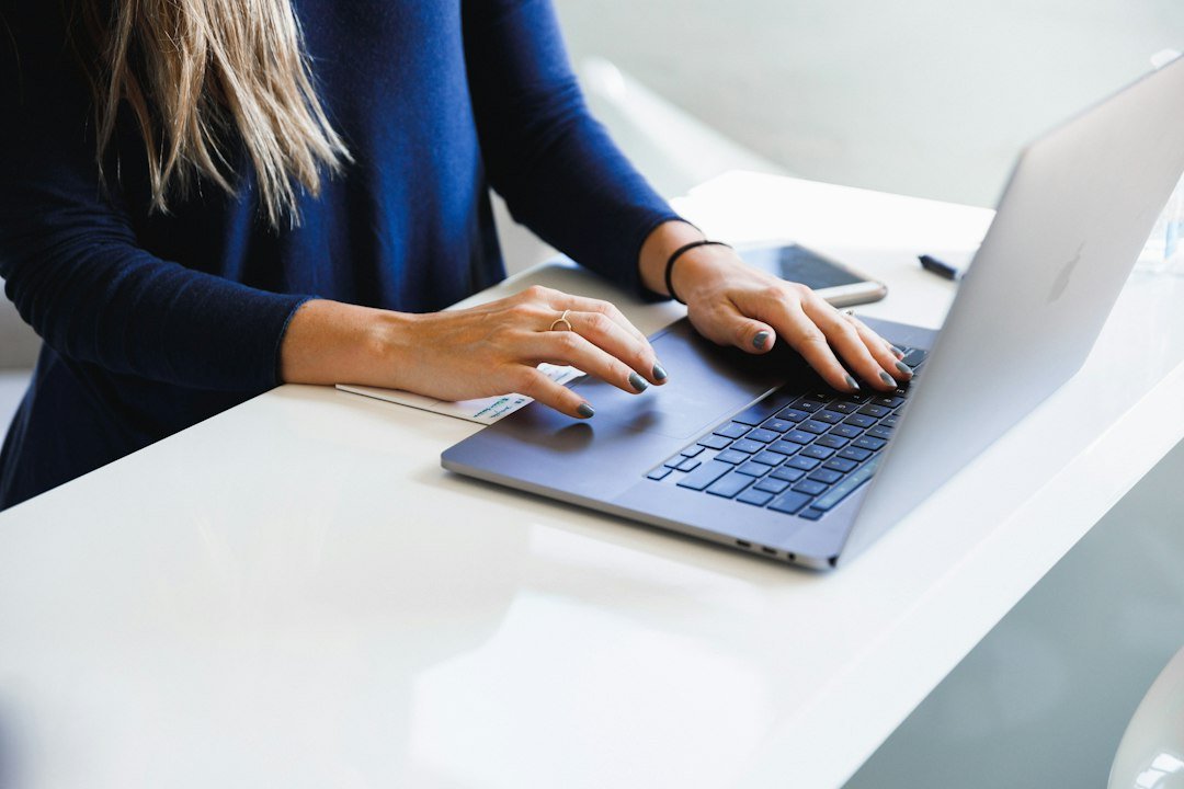 Marketer writing a personalised email for link building outreach on a laptop