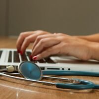 Stethoscope beside a laptop representing healthcare SEO for medical websites