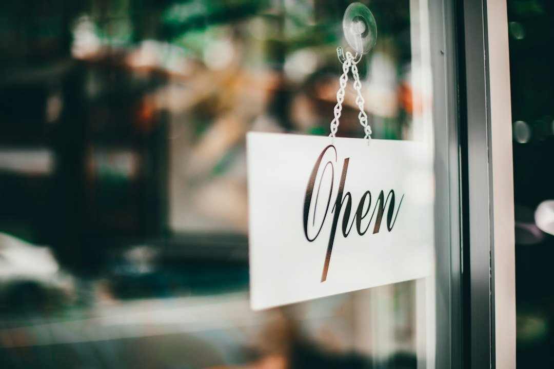 Open for business sign at a shop that local SEO companies help get found in Google Maps