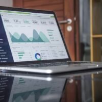 Ahrefs alternatives compared on a laptop showing SEO traffic charts