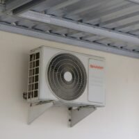 SEO for HVAC companies 2026 - outdoor air conditioning unit on a home wall