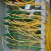 IT outsourcing - fibre optic cables in a managed server rack